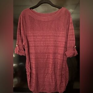 Gently loved sweater with ruching at the hips. 
Sleeves are slightly rolled.